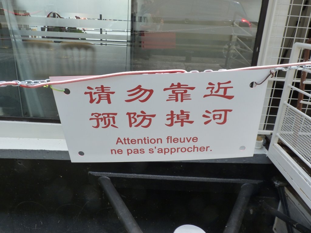 Pancarte \"Attention fleuve\"